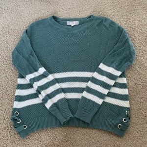 Green sweater, with lace up detailing on the sides